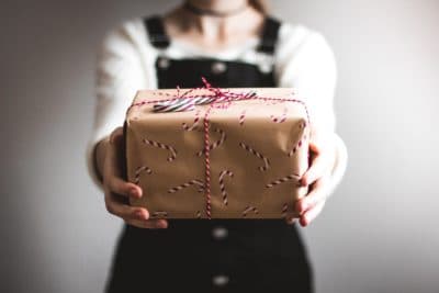 Woman Holding Gift in Hands