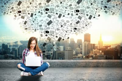 Girl Writing Social Media Posts on Laptop