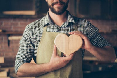 Worker Holding a Heart Representing Brands with a Purpose