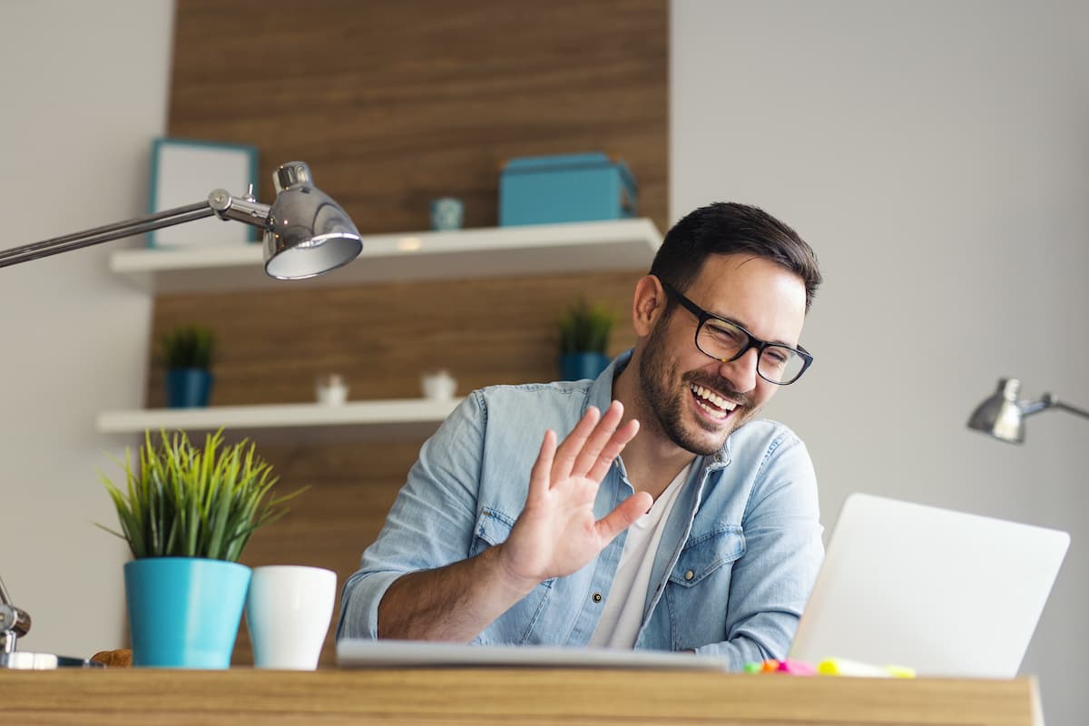 CEO Waving at Laptop to Make Business Brand More Personal